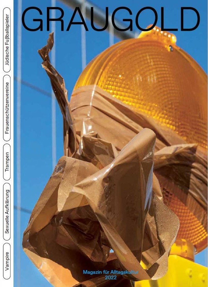 Cover der zweiten Ausgabe mit der Nahaufnahme einer Verkehrsleuchte, die mit Klebeband beklebt ist.