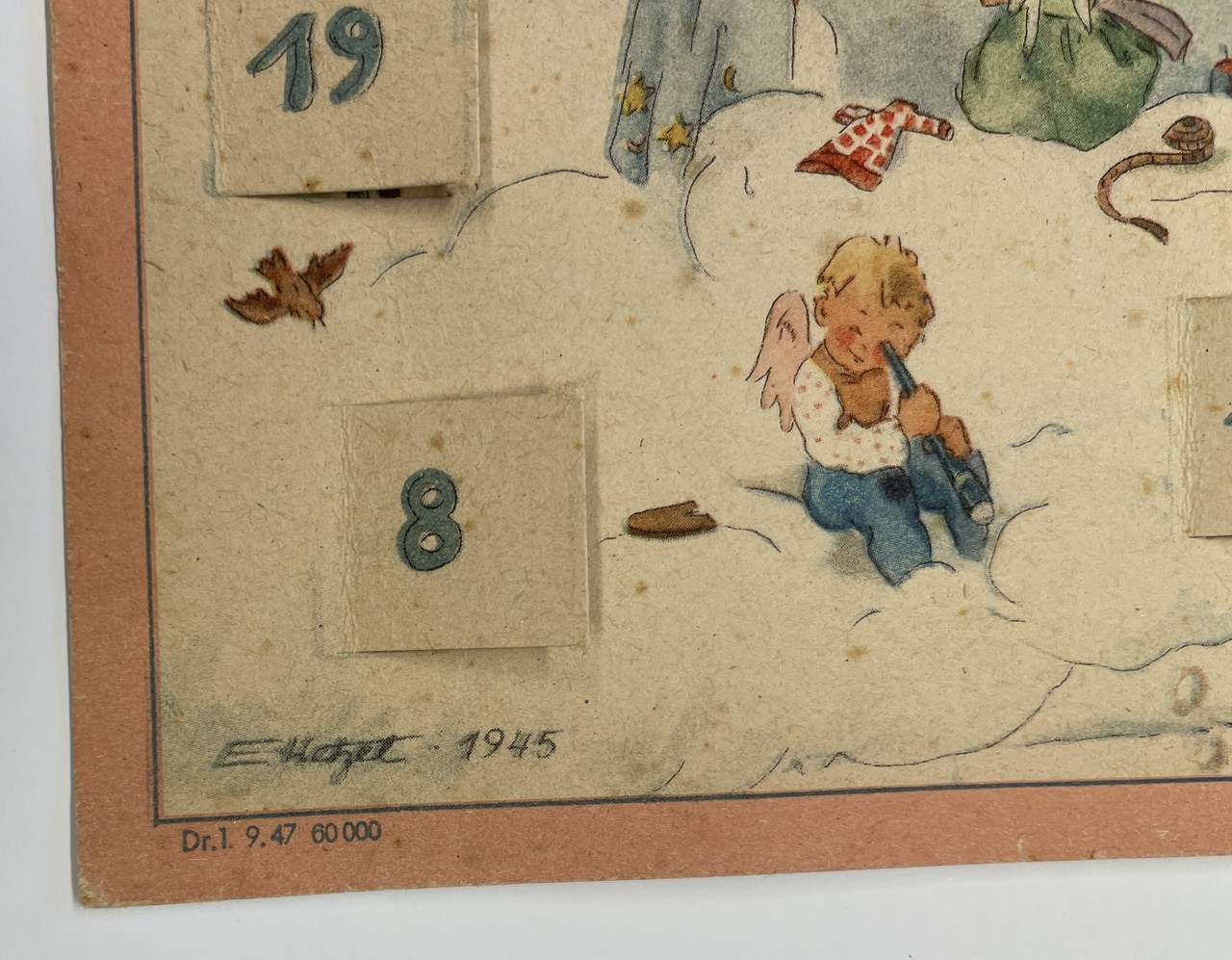 Signatur des unbekannten Künstlers E. Hetzel von 1945 sowie die Auflage- und Genehmigungsnummer des Kalenders aus dem Jahr 1947.